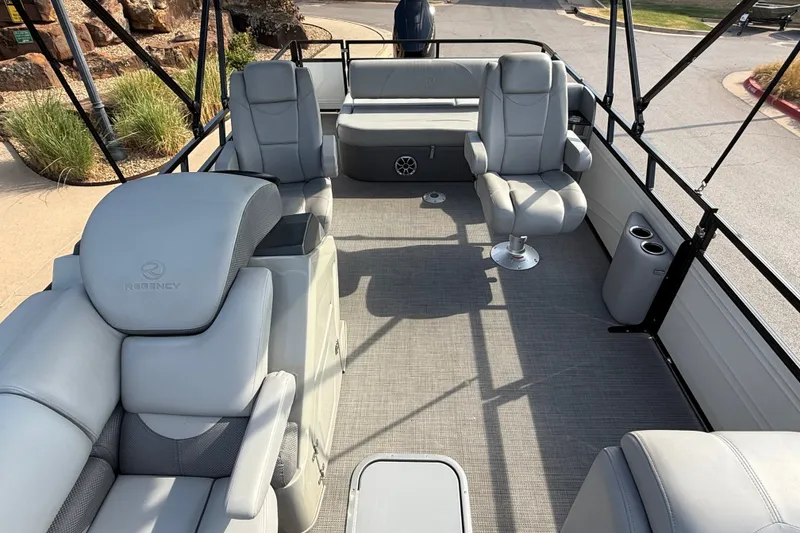 Slide: The Image of Luxurious interior of 2024 Regency 250 DL3 pontoon boat with plush seating and modern design. - 6