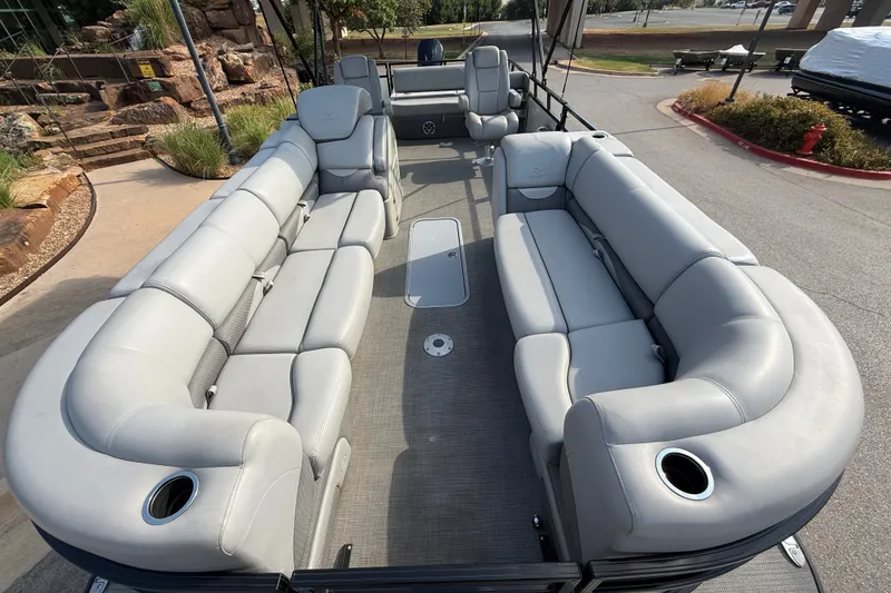 Slide: The Image of 2024 Regency 250 DL3 pontoon boat with spacious seating and modern design. - 5