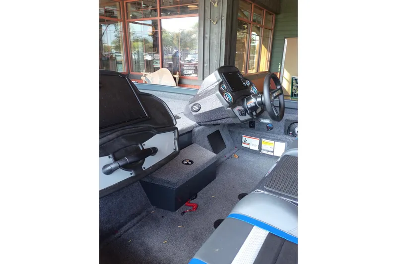 Slide: The Image of Interior view of 2026 Ranger RT198P boat cockpit with steering wheel and controls. - 1