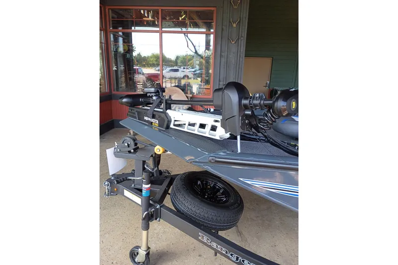 Slide: The Image of 2026 Ranger RT198P boat with Minn Kota trolling motor, displayed outdoors. - 2