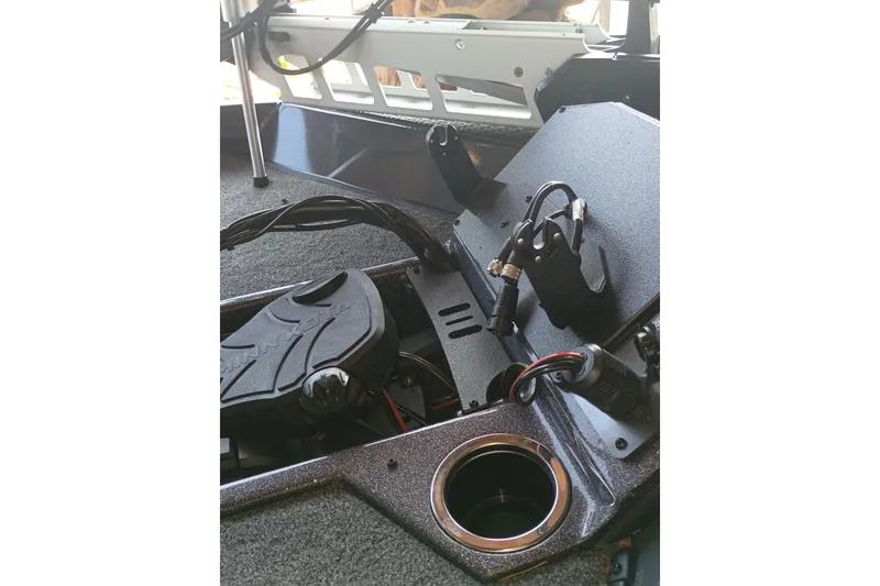 Slide: The Image of Interior view of 2026 Ranger RT198P boat, featuring control panel and cup holder. - 8