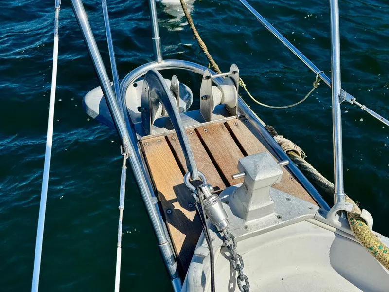 Slide: The Image of Bow of 1989 Nonsuch 30 Ultra sailboat with anchor and chain on deck. - 13