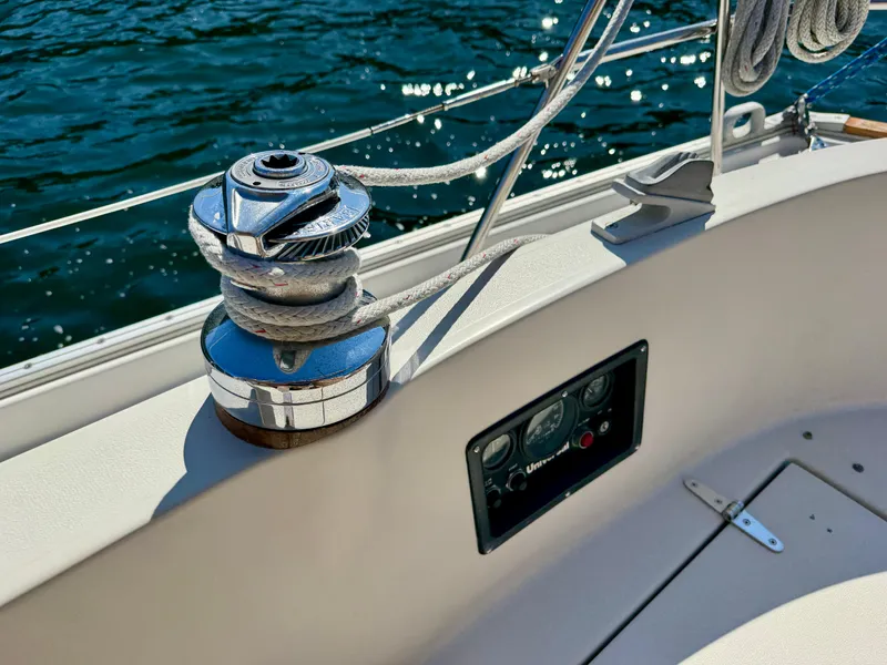 Slide: The Image of Winch and control panel on 1989 Nonsuch 30 Ultra sailboat, with ocean background. - 22