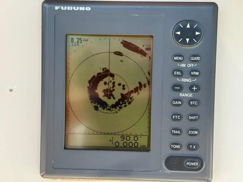 Slide: The Image of Furuno radar display on 1989 Nonsuch 30 Ultra sailboat, showing navigation data. - 35