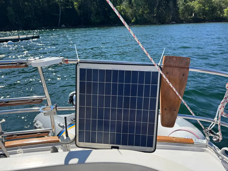 Slide: The Image of Solar panel on 1989 Nonsuch 30 Ultra sailboat, lake view in background. - 38