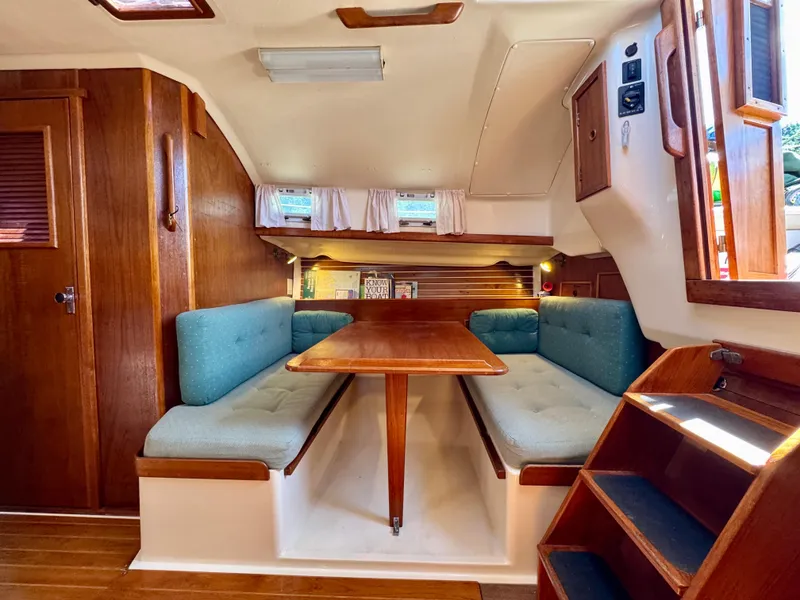 Slide: The Image of Cozy interior of 1989 Nonsuch 30 Ultra sailboat with wooden dining area. - 47