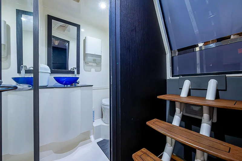 Slide: The Image of Luxurious bathroom interior of 2021 Gulf Crosser 52 yacht with modern fixtures and wooden steps. - 17