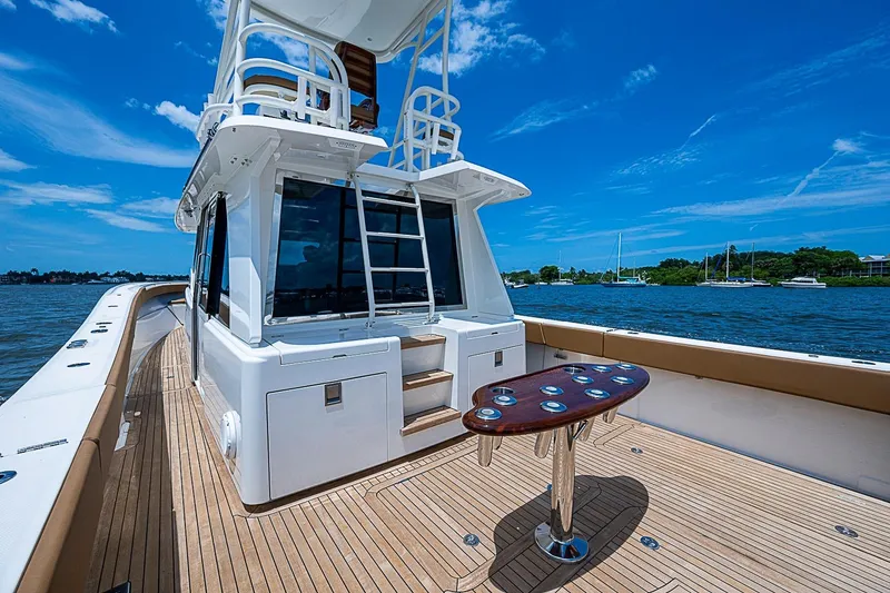 Slide: The Image of Luxurious 2021 Gulf Crosser 52 yacht deck with sleek design and scenic water view. - 23