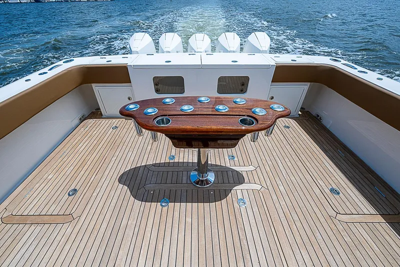 Slide: The Image of Luxury Gulf Crosser 52 yacht deck with elegant wooden table, 2021 model, cruising on open water. - 25