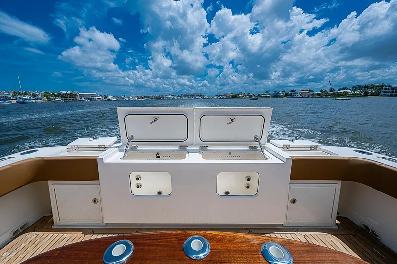Slide: The Image of Gulf Crosser 52 yacht deck with open storage, cruising on a sunny day, 2021 model. - 26