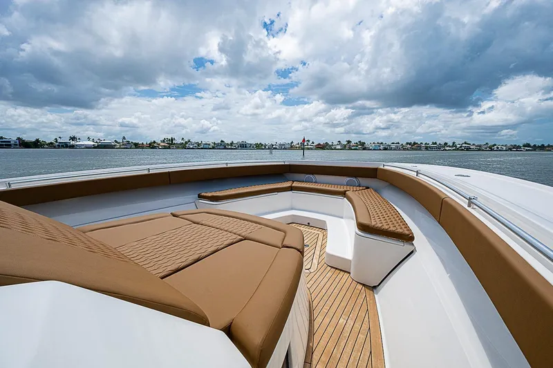 Slide: The Image of Luxurious 2021 Gulf Crosser 52 yacht deck with plush seating and scenic water view. - 3