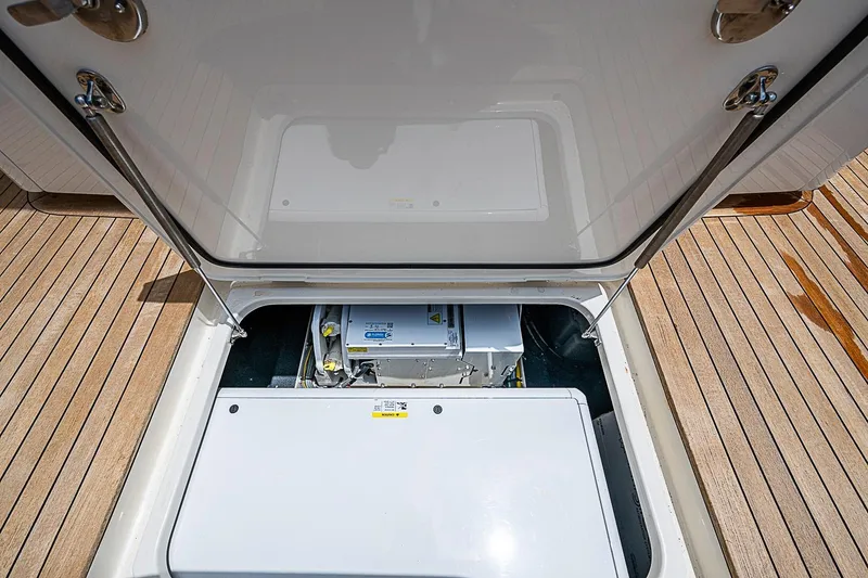 Slide: The Image of Open hatch on 2021 Gulf Crosser 52 boat, revealing engine compartment. - 34