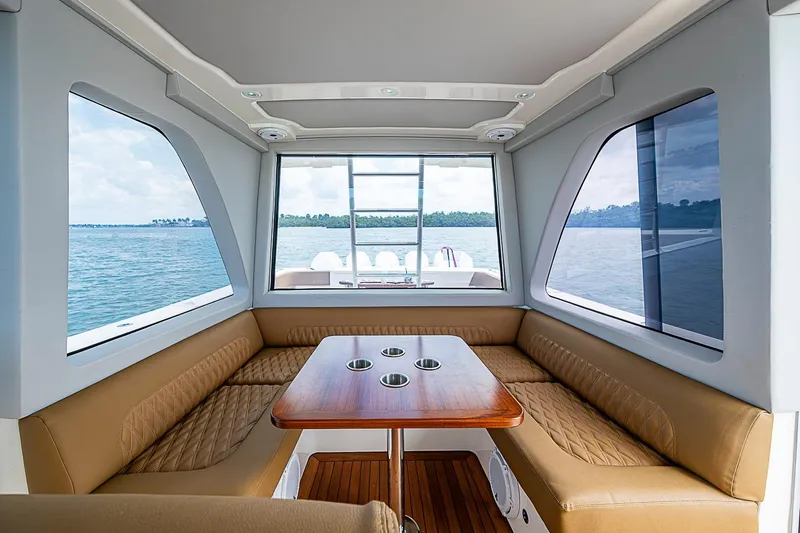 Slide: The Image of Interior of 2021 Gulf Crosser 52 yacht with seating and table, overlooking the ocean. - 41