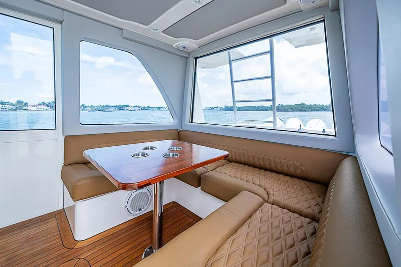 Slide: The Image of Luxurious interior of 2021 Gulf Crosser 52 yacht with leather seating and wooden table. - 42