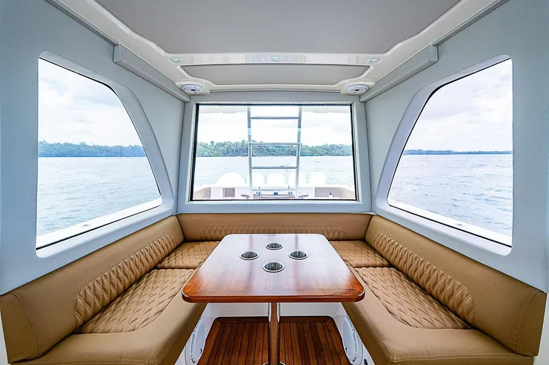 Slide: The Image of Luxurious interior of 2021 Gulf Crosser 52 yacht with panoramic windows and elegant seating. - 45