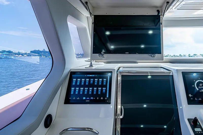 Slide: The Image of Interior view of 2021 Gulf Crosser 52 yacht with advanced navigation screens. - 49