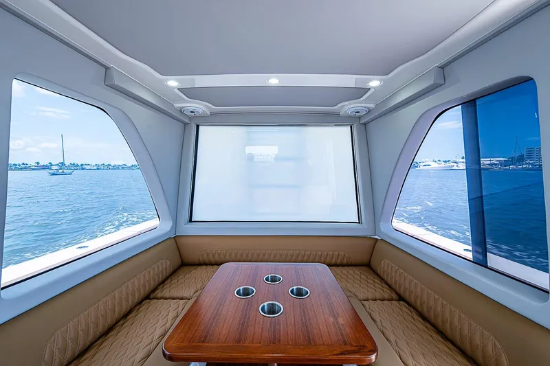 Slide: The Image of Luxurious interior of 2021 Gulf Crosser 52 yacht with panoramic windows and elegant seating. - 50