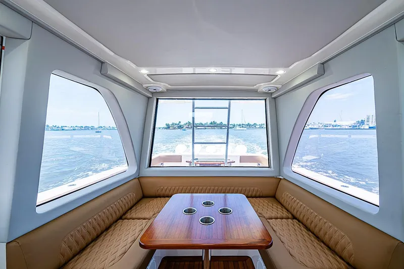 Slide: The Image of Interior of 2021 Gulf Crosser 52 yacht with panoramic windows and elegant seating area. - 51