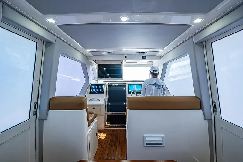 Slide: The Image of Interior of 2021 Gulf Crosser 52 yacht with modern helm and seating. - 53