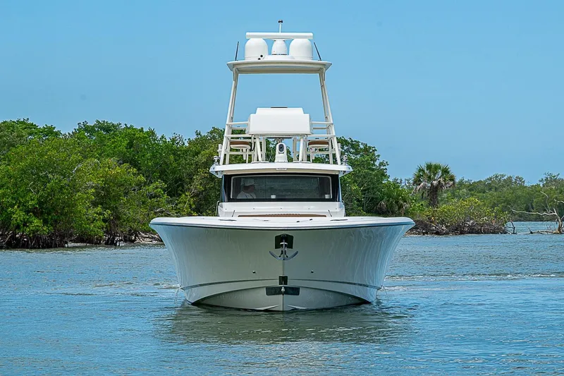 Slide: The Image of Front view of a 2021 Gulf Crosser 52 yacht on a serene waterway. - 69