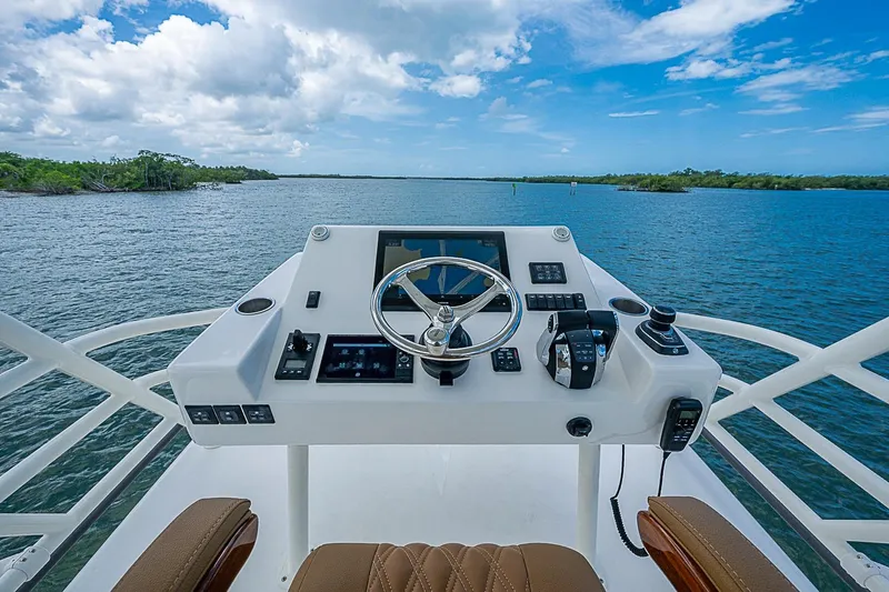 Slide: The Image of Helm of 2021 Gulf Crosser 52 yacht with scenic water view. - 73
