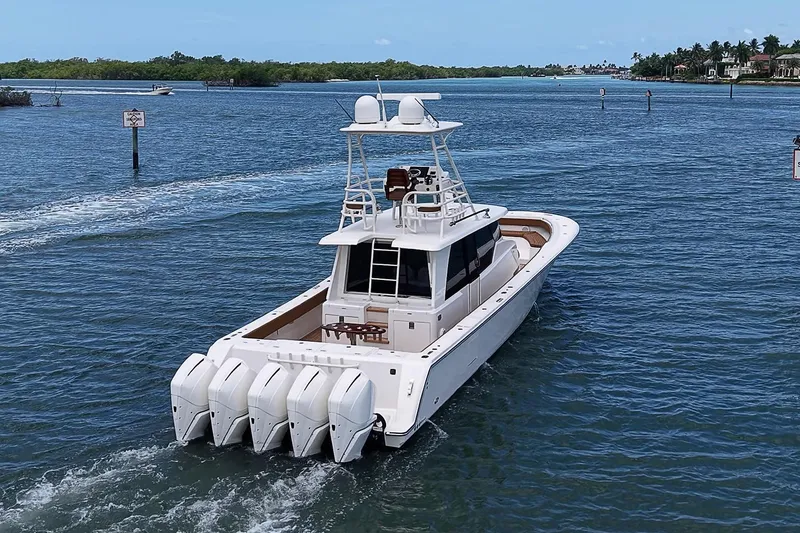 Slide: The Image of 2021 Gulf Crosser 52 yacht cruising on a serene blue waterway. - 77