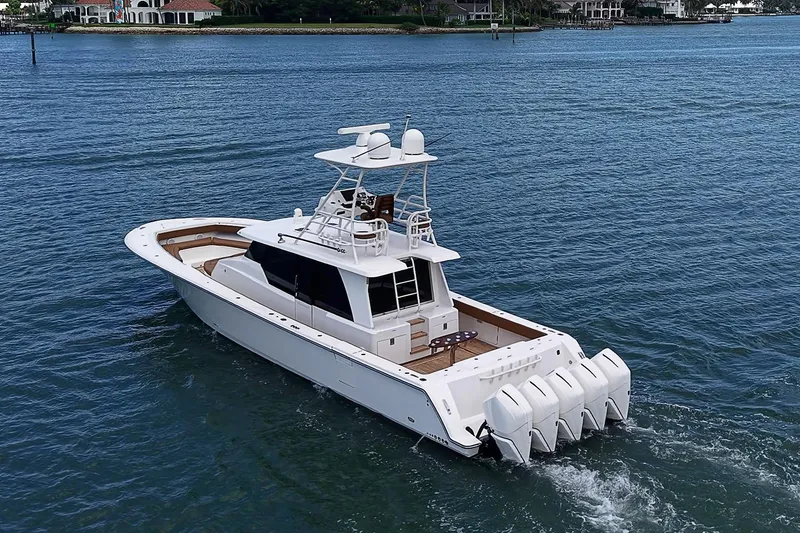 Slide: The Image of 2021 Gulf Crosser 52 yacht cruising on open water, showcasing sleek design and powerful engines. - 78