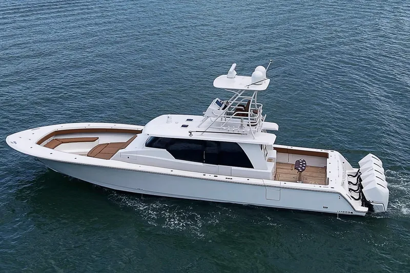 Slide: The Image of 2021 Gulf Crosser 52 yacht cruising on open water, showcasing sleek design and powerful engines. - 80