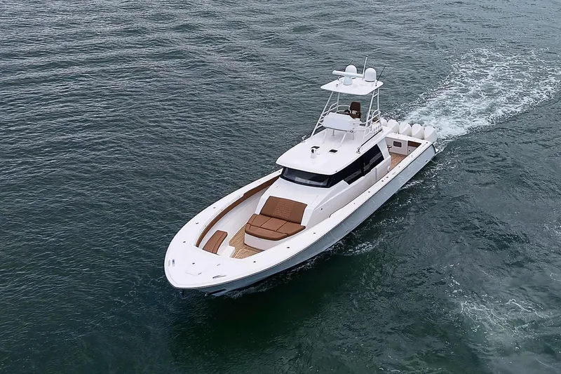 Slide: The Image of 2021 Gulf Crosser 52 yacht cruising on open water, showcasing sleek design and luxury features. - 81