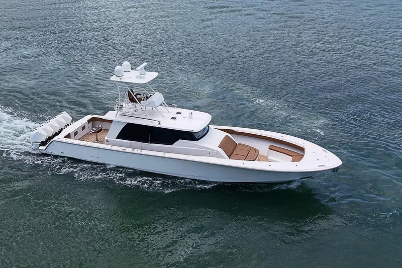 Slide: The Image of 2021 Gulf Crosser 52 yacht cruising on open water, showcasing sleek design and luxury features. - 82