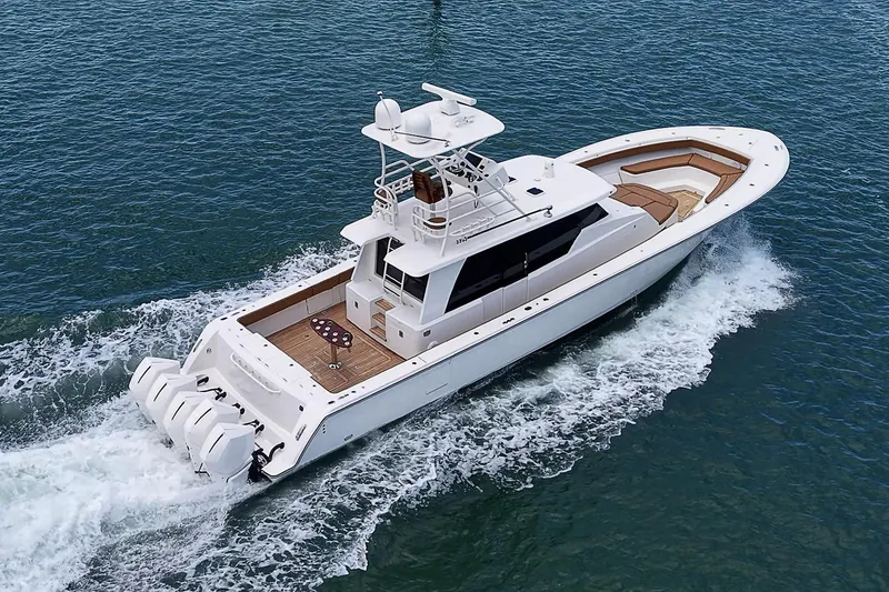 Slide: The Image of 2021 Gulf Crosser 52 yacht cruising on open water, showcasing sleek design and powerful engines. - 83