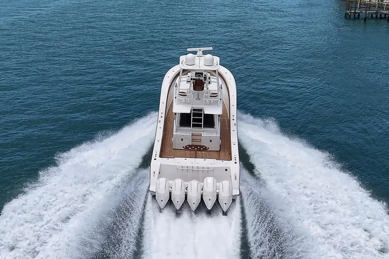 Slide: The Image of 2021 Gulf Crosser 52 yacht cruising on open water, rear view. - 85