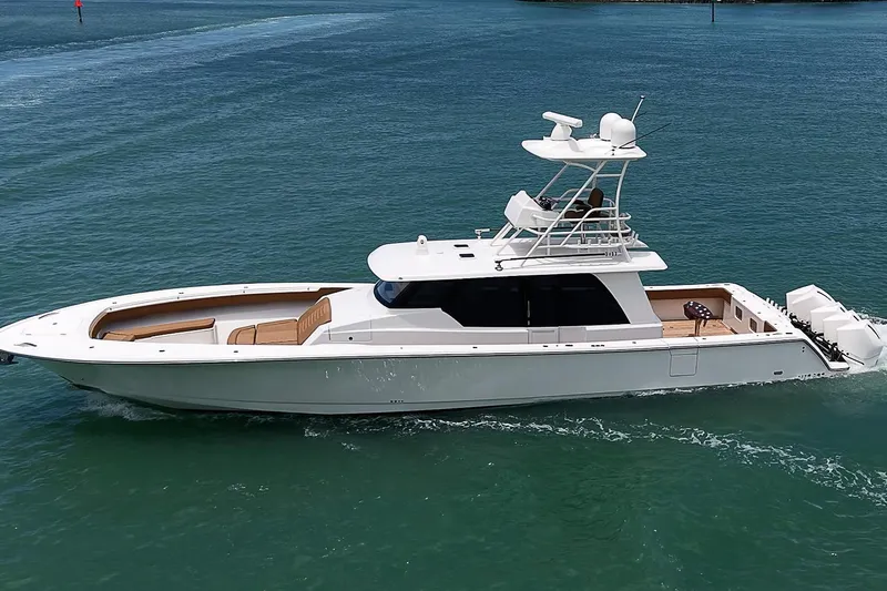 Slide: The Image of 2021 Gulf Crosser 52 yacht cruising on clear blue water. - 88