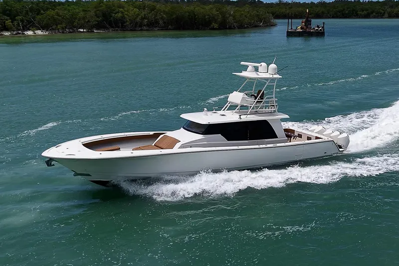 Slide: The Image of 2021 Gulf Crosser 52 yacht cruising on turquoise waters. - 89