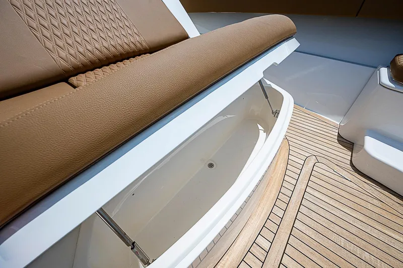 Slide: The Image of Luxurious seating and storage on 2021 Gulf Crosser 52 yacht with teak flooring. - 9
