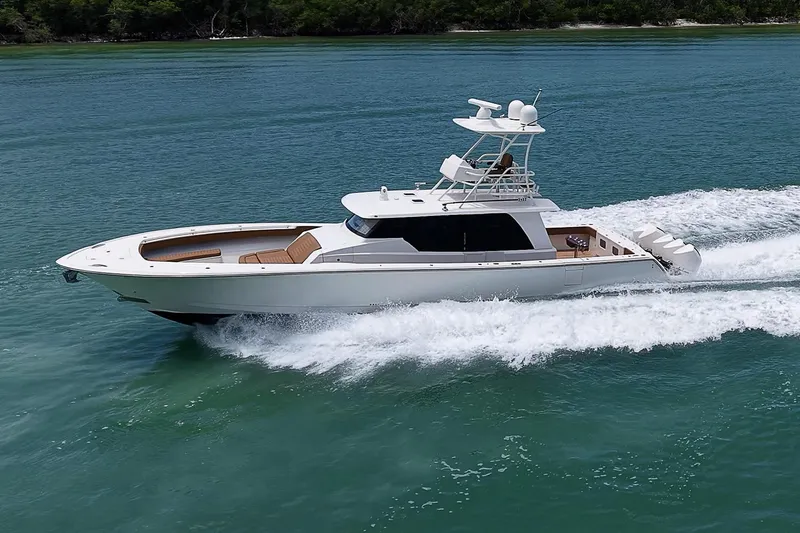 Slide: The Image of 2021 Gulf Crosser 52 yacht cruising on clear blue water. - 90
