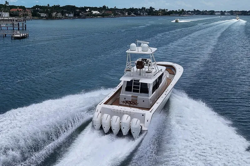 Slide: The Image of 2021 Gulf Crosser 52 yacht cruising on a scenic waterway with powerful engines. - 93