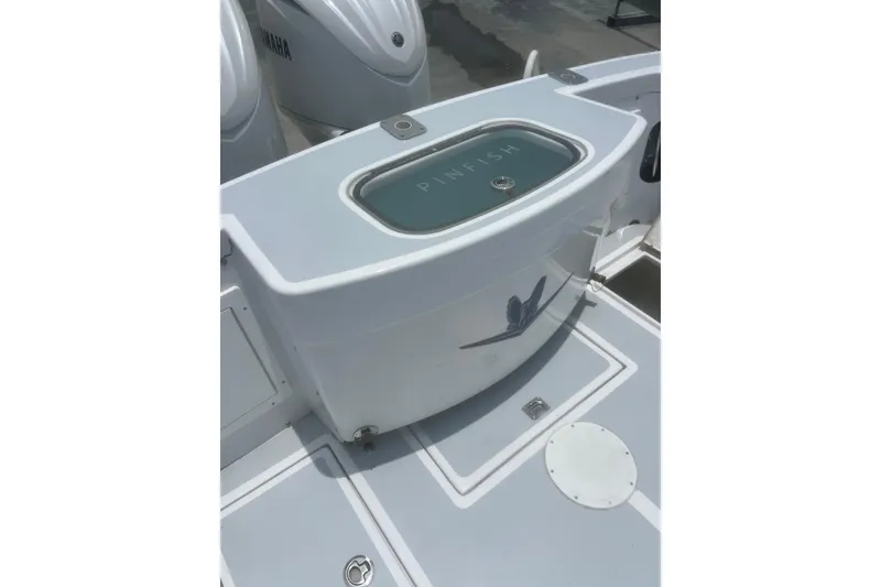 Slide: The Image of 1973 Bertram 31 Flybridge Cruiser deck with Yamaha engines and baitwell labeled "Pinfish." - 14