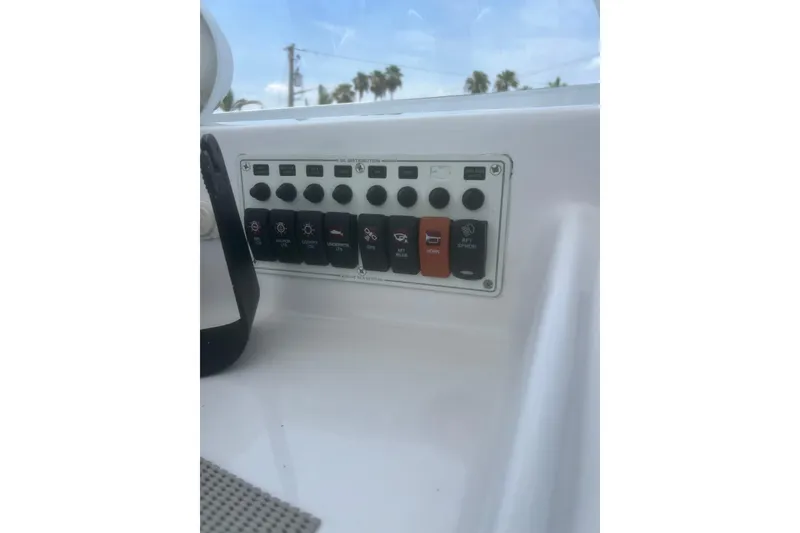 Slide: The Image of Control panel on a 1973 Bertram 31 Flybridge Cruiser boat. - 24