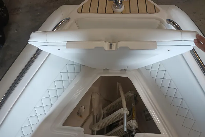 Slide: The Image of 2014 AB Inflatables Nautilus 17 DLX boat storage compartment with white cushioned seating. - 11
