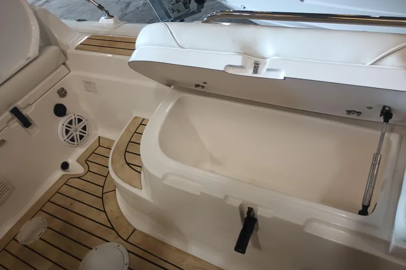 Slide: The Image of 2014 AB Inflatables Nautilus 17 DLX boat interior with open storage compartment and teak flooring. - 13