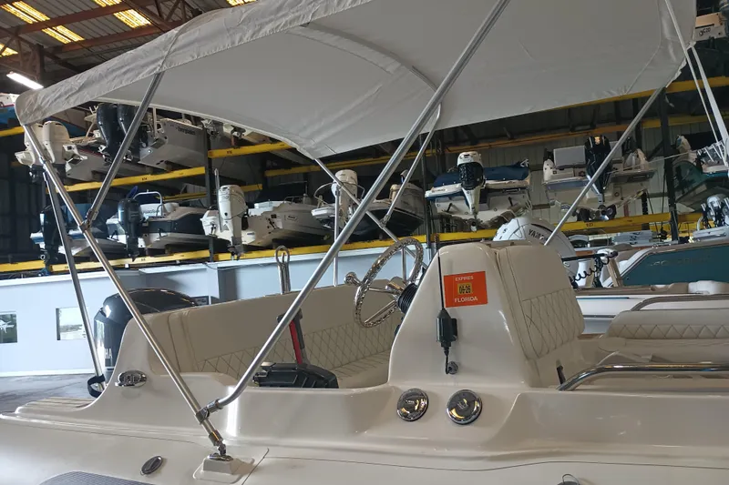 Slide: The Image of 2014 AB Inflatables Nautilus 17 DLX boat with canopy in storage facility. - 14