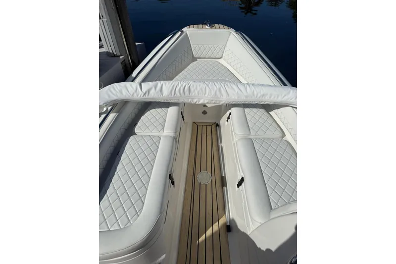 Slide: The Image of 2014 AB Inflatables Nautilus 17 DLX boat with white quilted seating and wooden deck. - 20