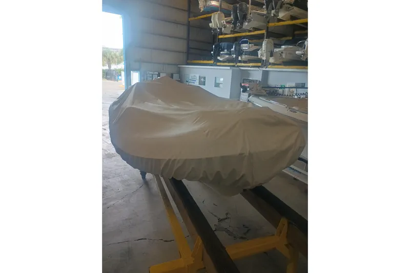 Slide: The Image of Covered 2014 AB Inflatables Nautilus 17 DLX boat in storage facility. - 23