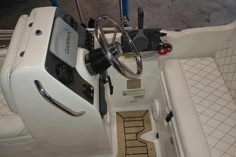 Slide: The Image of 2014 AB Inflatables Nautilus 17 DLX boat cockpit with Garmin navigation system and steering wheel. - 4