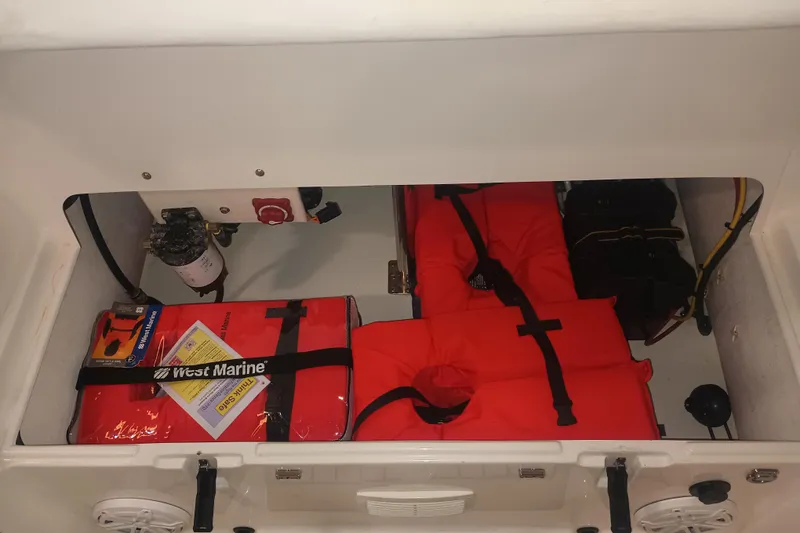 Slide: The Image of Storage compartment of 2014 AB Inflatables Nautilus 17 DLX with life jackets and marine gear. - 8