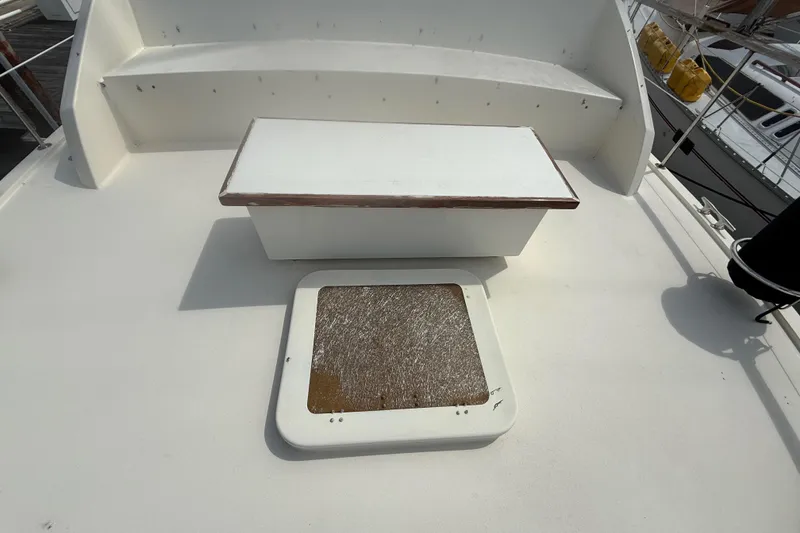Slide: The Image of 1981 Hatteras 43 Motor Yacht deck with seating and hatch. - 15