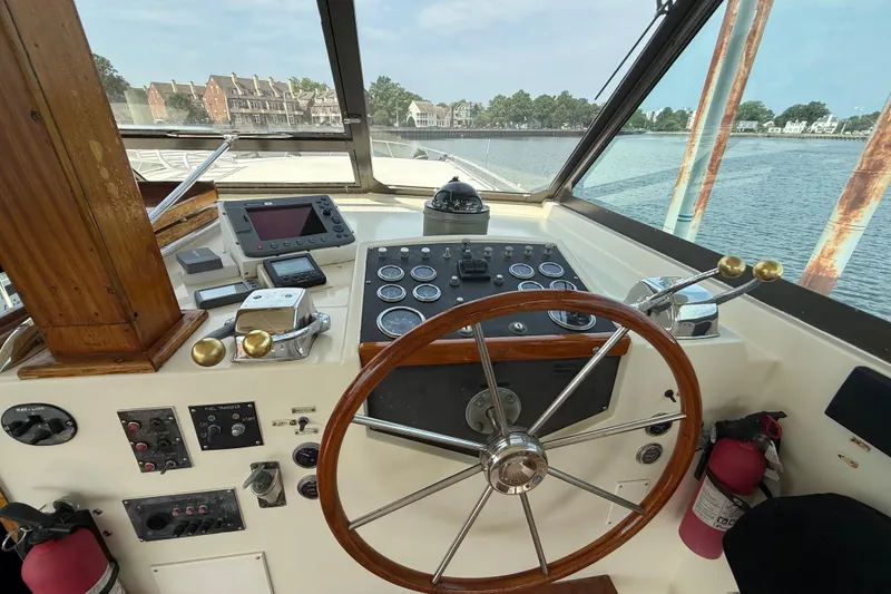 Slide: The Image of Helm of 1981 Hatteras 43 Motor Yacht with steering wheel and navigation instruments. - 22