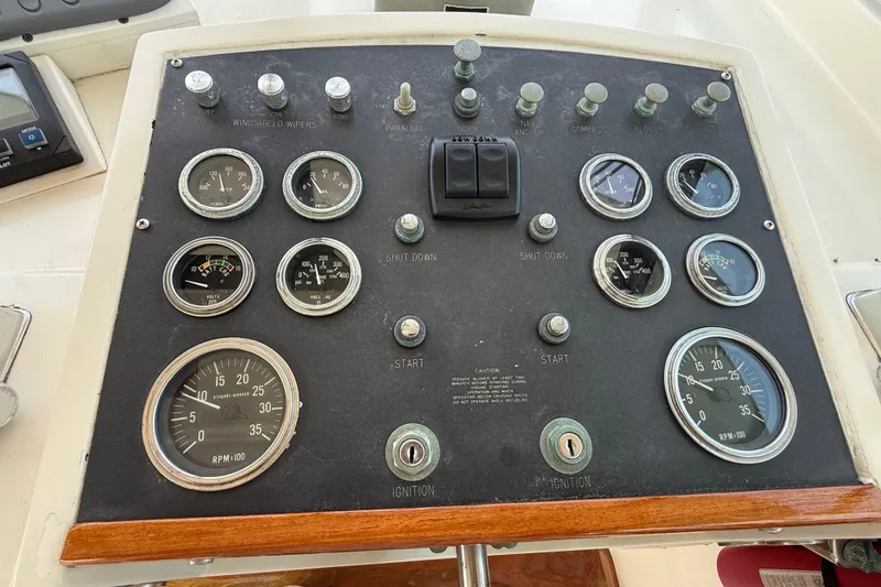 Slide: The Image of Control panel of a 1981 Hatteras 43 Motor Yacht with gauges and switches. - 24