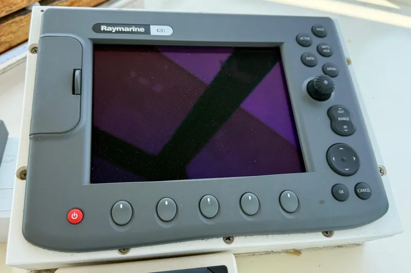 Slide: The Image of Raymarine C80 navigation display on 1981 Hatteras 43 Motor Yacht dashboard. - 26